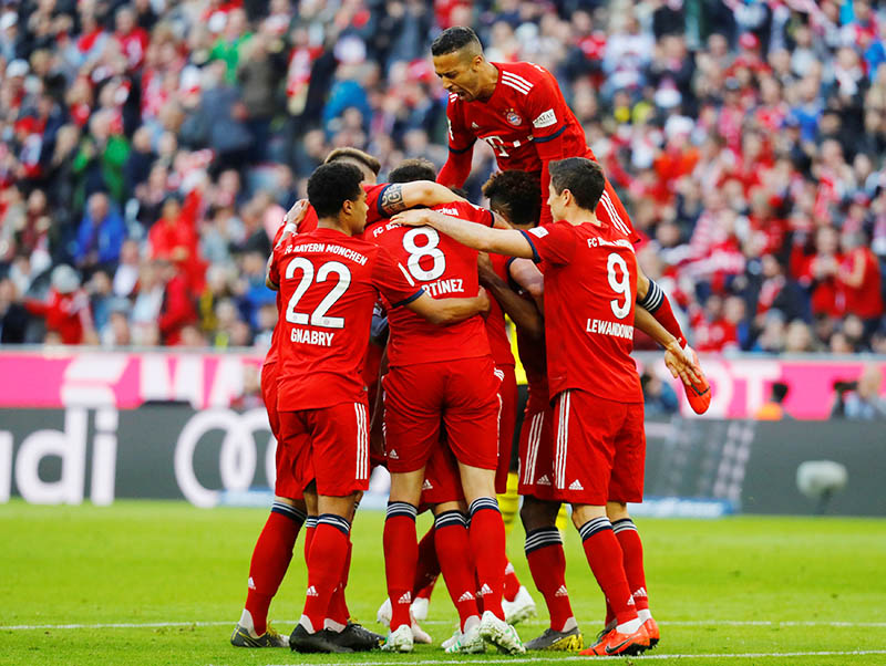 Bayern Munich's Mats Hummels celebrates scoring their first goal with team mates. Photo: Reuters