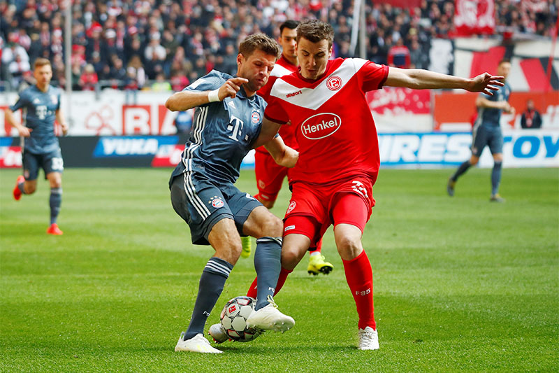 Bayern Munich's Thomas Mueller in action with Fortuna Dusseldorf's Marcel Sobottka. Photo: Reuters