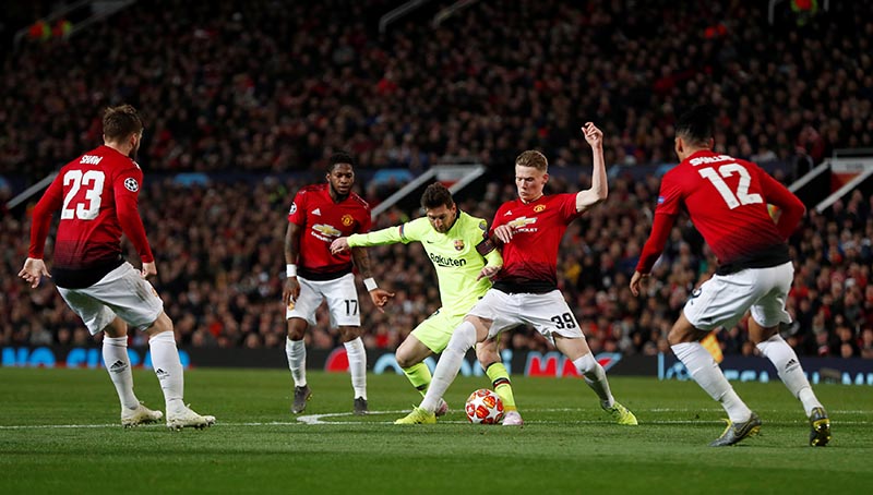 Manchester United's Scott McTominay in action with Barcelona's Lionel Messi during the Champions League Quarter Final First Leg, match between Manchester United and FC Barcelona, at Old Trafford, in Manchester, Britain, on April 10, 2019. Photo: Action Images via Reuters