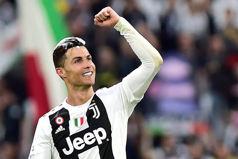 Juventus' Cristiano Ronaldo celebrates winning the league after the match. Photo: Reuters