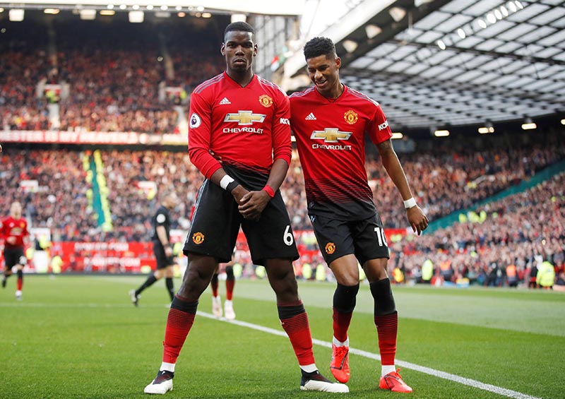 Manchester United's Paul Pogba celebrates scoring their second goal with Marcus Rashford during the Premier League match between Manchester United and West Ham United, at Old Trafford, in Manchester, Britain, on April 13, 2019. Photo: Action Images via Reuters