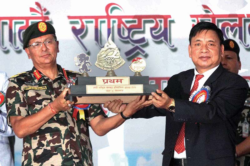 Chief of Army Staff Purna Chandra Thapa receives winner's trophy from the Vice-president Nanda Kishore Pun during the closing ceremony of the 8th National Games at Nepalgunj Stadium in Nepalgunj on Wednesday. Photo: Udipt Singh Chhetry/ THT