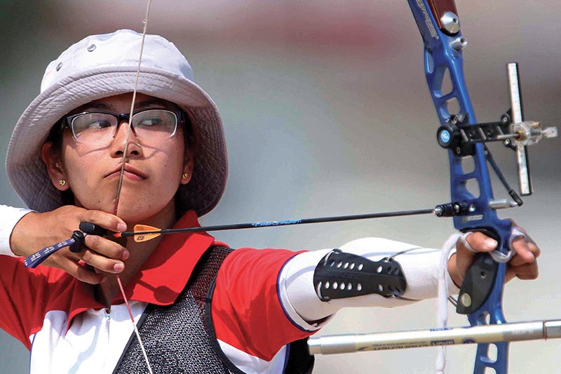 Archana Thapa Magar of Annapurna Archery Club aims target during the women’s standard 30m event, under the eighth National Games on Sunday. Photo: Udipt Singh Chhetry / THT