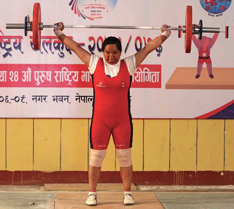 Tara Devi Pun of Nepal Police Club lifts weight in the women’s 76kg weight category, under the eighth National Games on Sunday. Photo: Udipt Singh Chhetry / THT