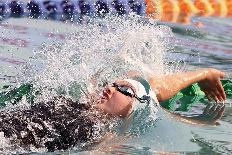 Gaurika Singh of Tribhuvan Army Club swims during the womenu2019s 50m backstroke finals, under the eighth National Games on Sunday. Photo: Udipt Singh Chhetry / THT