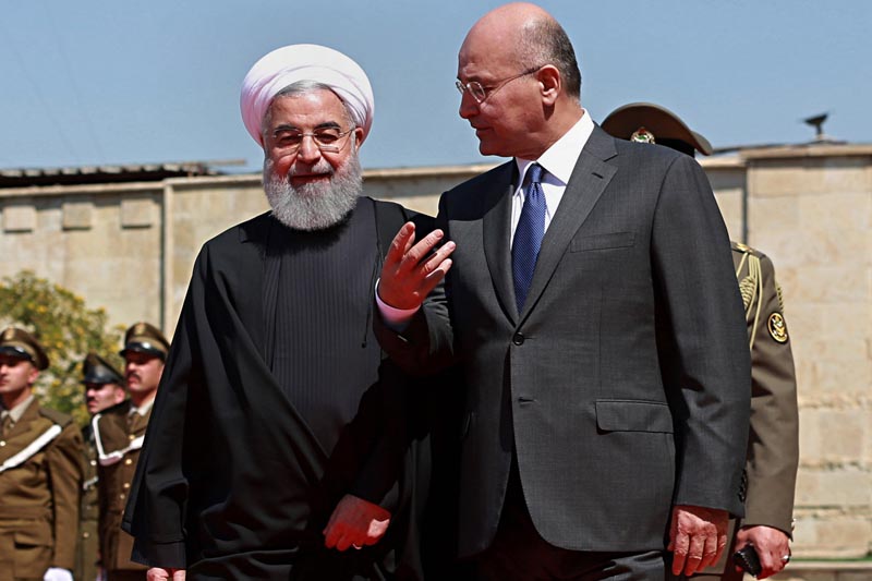 FILE: In this March 11, 2019 file photo, Iraqi President Barham Salih (right) walks with visiting Iranian President Hassan Rouhani, before their meeting at Salam Palace in Baghdad, Iraq. Photo: AP/File