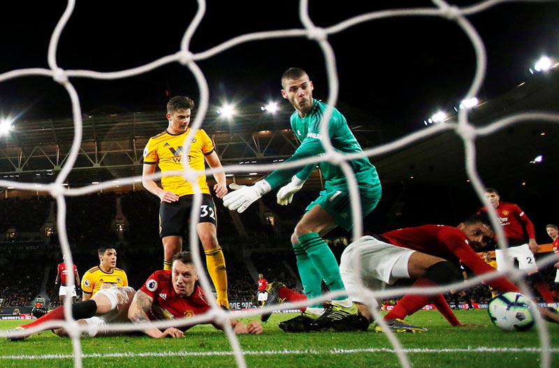 Manchester United's Chris Smalling scores an own goal and the second for Wolverhampton Wanderers during the  Premier League match between Wolverhampton Wanderers and Manchester United, at Molineux Stadium, in Wolverhampton, Britain, on April 2, 2019. Photo: Action Images via Reuters