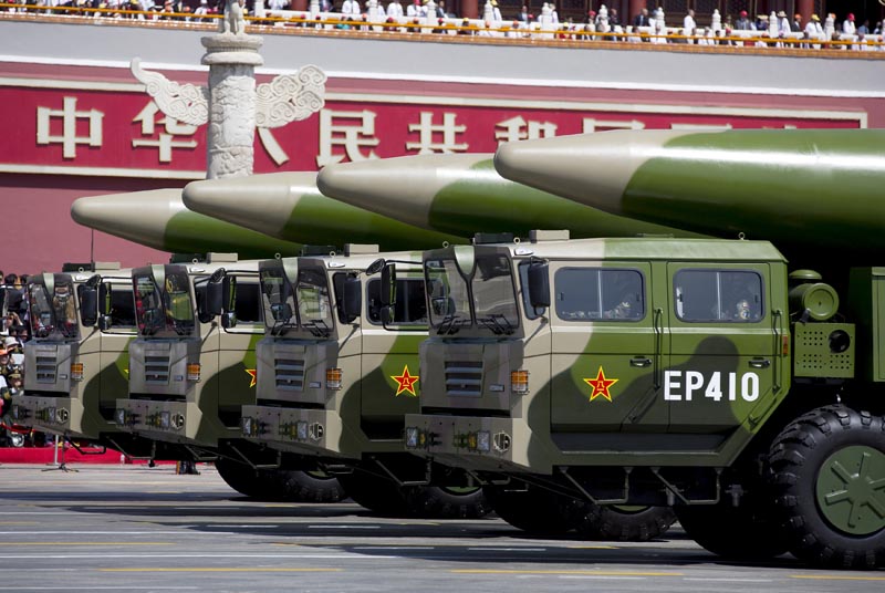 Military vehicles carrying DF-26 ballistic missiles travel past Tiananmen Gate during a military parade to commemorate the 70th anniversary of the end of World War II in Beijing Thursday September 3, 2015. Photo: Andy Wong/Pool via Reuters/File
