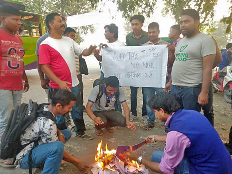 Youths burning Ncell SIM cards in protest in Kawasoti, on Wednesday, April 24, 2019. Photo: Shreeram Sigdel/THT