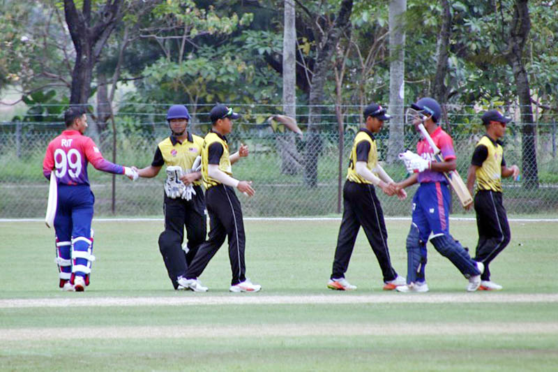 Nepali players shake hands with Malaysian player after the end of the game. Courtesy: Raman Siwakoti