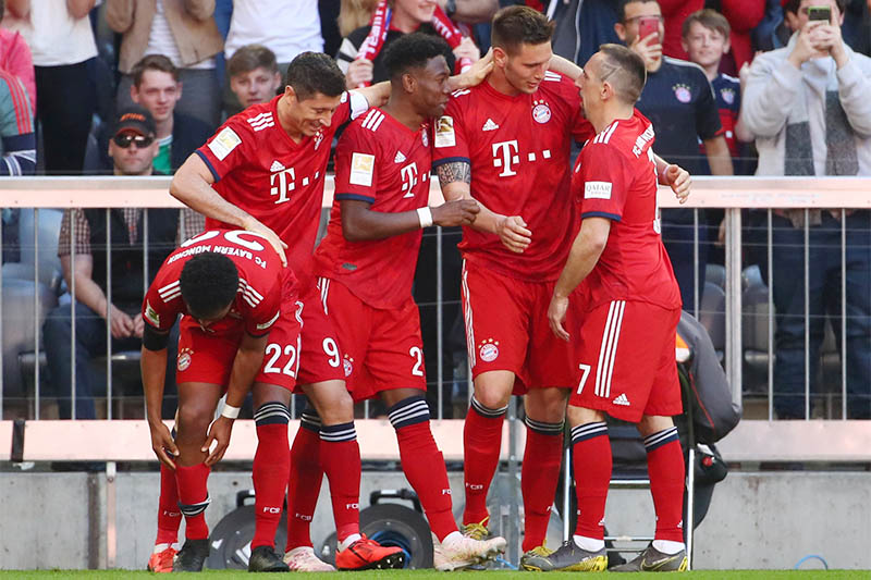 Bayern Munich's Niklas Sule celebrates scoring their first goal with team mates. Photo: Reuters