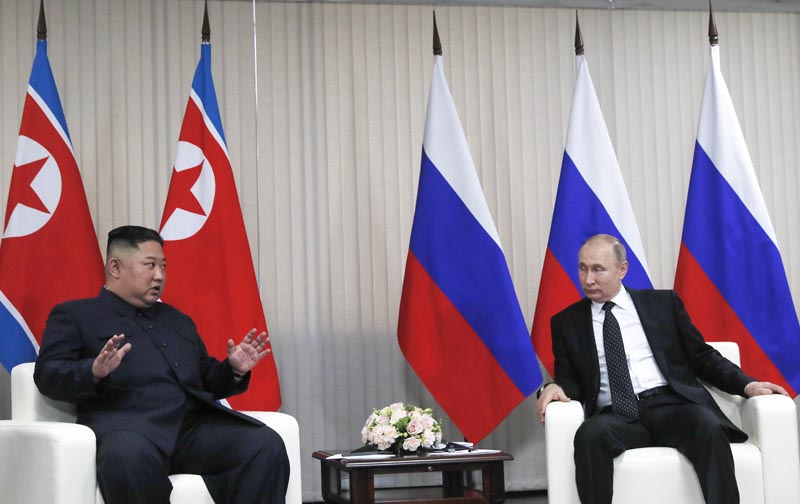 Russian President Vladimir Putin, right, and North Korea's leader Kim Jong Un talk during their meeting in Vladivostok, Russia, Thursday, April 25, 2019. Photo: Sergei Ilnitsky/Pool Photo via AP