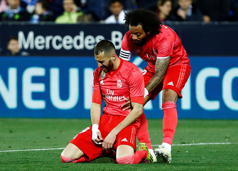 Real Madrid's Karim Benzema reacts with Marcelo during the La Liga Santander match between Leganes and Real Madrid, at Butarque Municipal Stadium, in Leganes, Spain, on April 15, 2019. Photo: Reuters