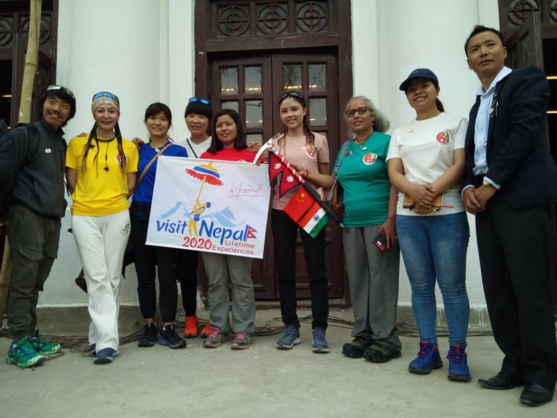 Three women -- Kanchhi Maya Tamang  from Nepal,  Kalpana Dash from India and Liyamu Ma from China who are going on an Everest Expedition -- pose for a photograph with the banner of Visit Nepal 2020. Photo: THT