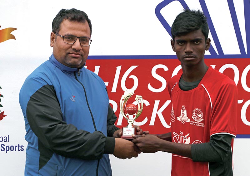 Ramesh Kurmi of Province 5 receives the man-of-the-match trophy after U-16 National Cricket Tournament in Kathmandu on Thursday. Photo: THT