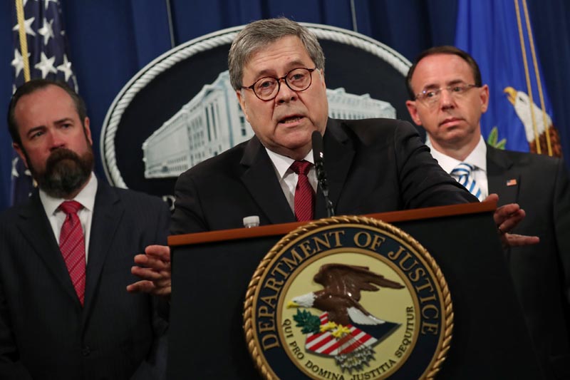 US Attorney General William Barr, flanked by Edward O'Callaghan, Acting Principal Associate Deputy Attorney General (L) and Deputy US Attorney General Rod Rosenstein, speaks at a news conference to discuss Special Counsel Robert Muelleru0092s report on Russian interference in the 2016 US presidential race, in Washington, US, April 18, 2019. Photo: Reuters