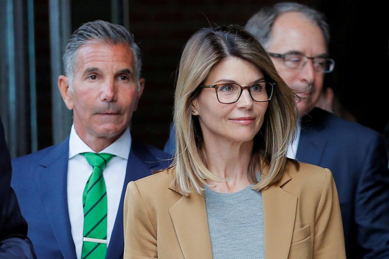 FILE: Actor Lori Loughlin, and her husband, fashion designer Mossimo Giannulli, leave the federal courthouse after facing charges in a nationwide college admissions cheating scheme, in Boston, Massachusetts, US, April 3, 2019.Photo: AP/file