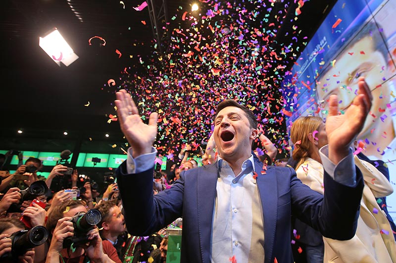 Ukrainian presidential candidate Volodymyr Zelenskiy reacts following the announcement of the first exit poll in a presidential election at his campaign headquarters in Kiev, Ukraine April 21, 2019. Photo: Reuters