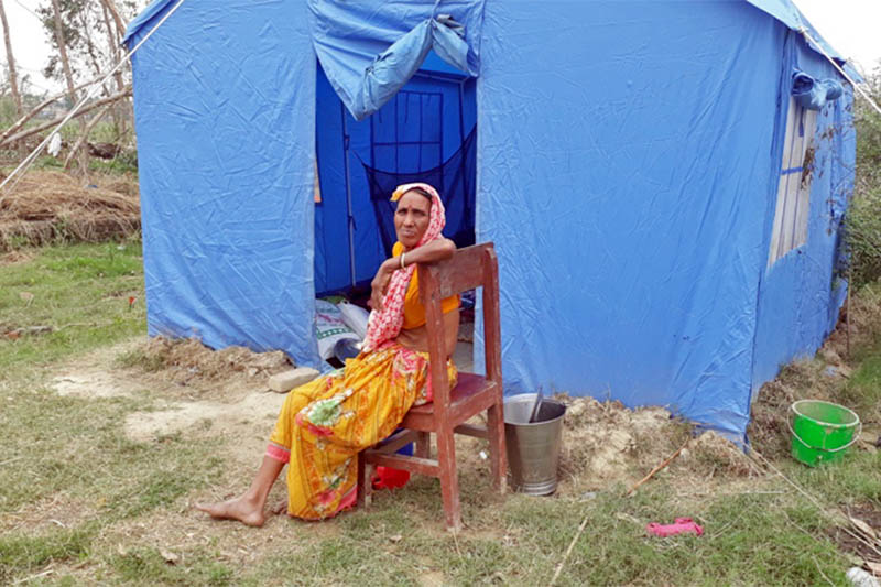 An elderly woman affected by tornado sits infront of her tent in Bara district, on Sunday, April 21, 2019. Photo: Puspa Raj Khatiwada/THT