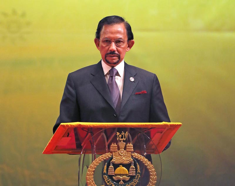 In this Oct, 10, 2013, photo, Brunei's Sultan Hassanal Bolkiah speaks during the closing ceremony and handover of the ASEAN Chairmanship to Myanmar in Bandar Seri Begawan. Photo: AP