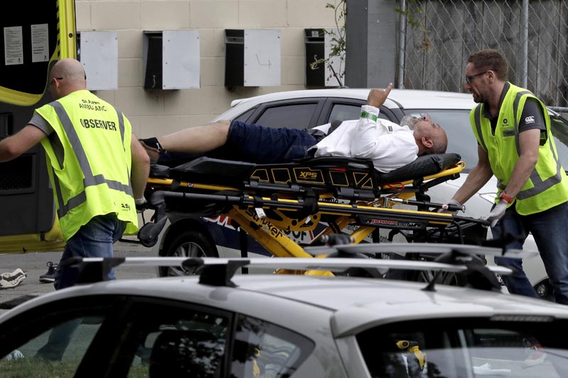 FILE: In this March 15, 2019, file photo, ambulance staff take a man from outside a mosque in central Christchurch, New Zealand. Photo: AP