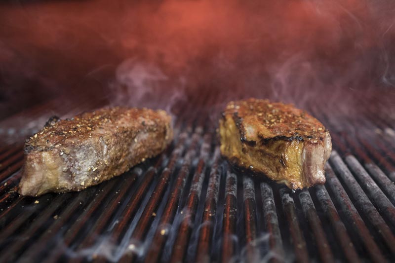 FILE: This November 27, 2018 file photo shows steaks on a grill at a restaurant in New York. Photo: AP