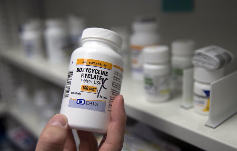 FILE - In this Friday, July 8, 2016 photo, a pharmacist holds a bottle of the antibiotic doxycycline hyclate in Sacramento, Calif. According to a study released on Monday, April 8, 2019. Photo: AP
