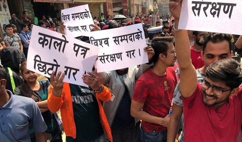 Locals of Bouddha obstruct the road, protesting the delay in blacktopping the road section, in Kathmandu, on Thursday, May 9, 2019. Photo: RSS