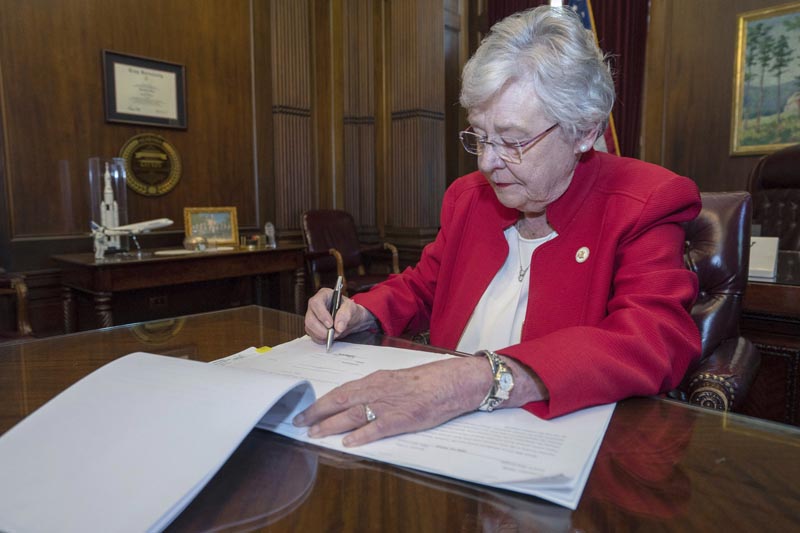 This photograph released by the state shows Alabama Governor Kay Ivey signing a bill that virtually outlaws abortion in the state on Wednesday, May 15, 2019, in Montgomery, Alabama. Photo: Hal Yeager/Alabama Governor's Office via AP