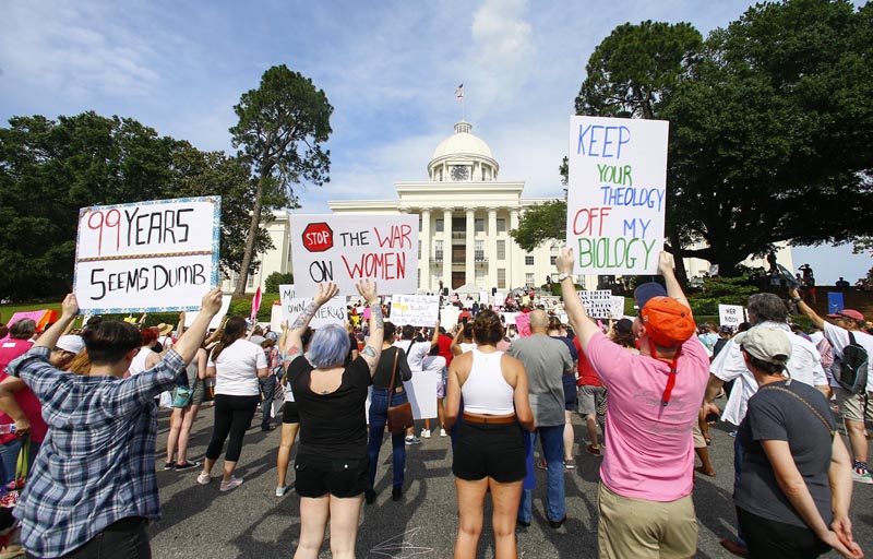 Protesters for women's rights hold a rally on the Alabama Capitol steps to protest a law passed last week making abortion a felony in nearly all cases with no exceptions for cases of rape or incest, Sunday, May 19, 2019, in Montgomery, Alabama. Photo: AP