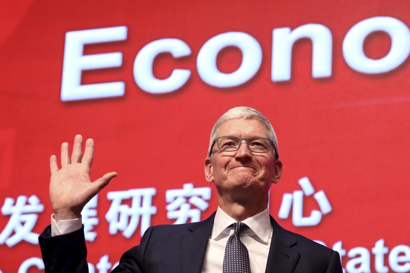 FILE: In this Saturday, March 23, 2019, file photo, Apple CEO Tim Cook waves as he arrives for the Economic Summit held for the China Development Forum in Beijing, China. Photo: AP/file