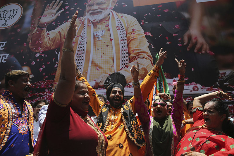 Bharatiya Janata Party (BJP) workers celebrate outside BJP headquarters in Mumbai, India, on Thursday, May 23, 2019. Indian Prime Minister Narendra Modi and his party were off to an early lead as vote counting began Thursday following the conclusion of the country's 6-week-long general election, sending the stock market soaring in anticipation of another five-year term for the Hindu nationalist leader. Photo: AP