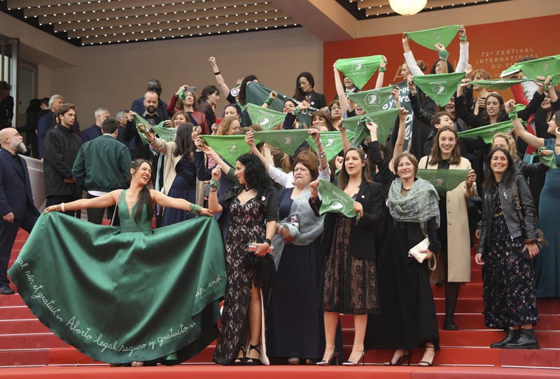 Cast and crew of the film 'Let it be Law' demonstrate for the legalization of abortion in Argentina upon arrival at the premiere of the film 'The Wild Goose Lake' at the 72nd international film festival, Cannes, Southern France, Saturday, May 18, 2019. Photo: AP