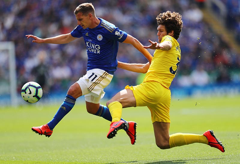 Chelsea's Marcos Alonso in action with Leicester City's Marc Albrighton during the Premier League match between Leicester City amd Chelsea, at King Power Stadium, in Leicester, Britain, on May 12, 2019. Photo: Reuters