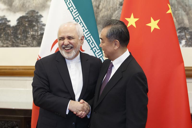 Chinese Foreign Minister Wang Yi meets Iranian Foreign Minister Mohammad Javad Zarif at the Diaoyutai State Guesthouse in Beijing, Friday, May 17, 2019. Photo: Thomas Peter/Pool Photo via AP