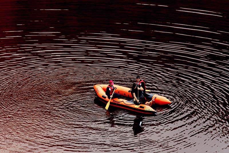 Members of the Cyprus Special Disaster Response Unit search for suitcases in a man-made lake, near the village of Mitsero outside of the capital Nicosia, Cyprus, on Wednesday, May 1, 2019. British forensics experts helping to tackle the Cyprus serial killer case visited a toxic lake Tuesday where a suitcase was found with a decomposed body inside as criticism mounted of how Cypriot police initially handled the disappearances of several victims. Photo: AP
