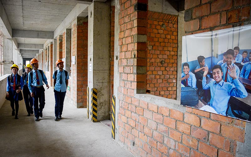 Students of Durbar High School taking a look at the under-construction building of the school, in Kathmandu, on Friday, May 24, 2019. Photo: Naresh Krishna Shrestha/THT