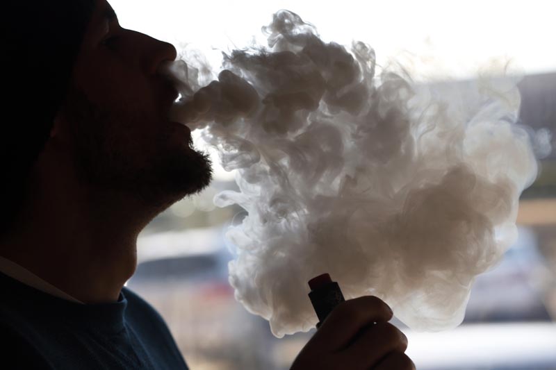 FILE: In this Friday, January 18, 2019 file photo, a customer blows a cloud of smoke from a vape pipe at a local shop in Richmond, Virginia. Photo: AP.