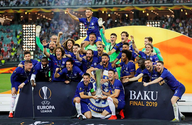 Chelsea's Gary Cahill, Cesar Azpilicueta and team mates celebrate winning the Europa League with the trophy at Baku Olympic Stadium, in Baku, Azerbaijan, on May 29, 2019. Photo: Reuters