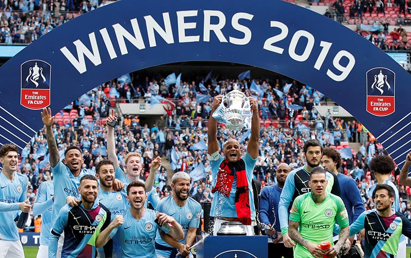 Manchester City celebrate with the trophy after winning the FA Cup finals between Manchester City and Watford, at Wembley Stadium, in London, Britain, on May 18, 2019. Photo: Reuters