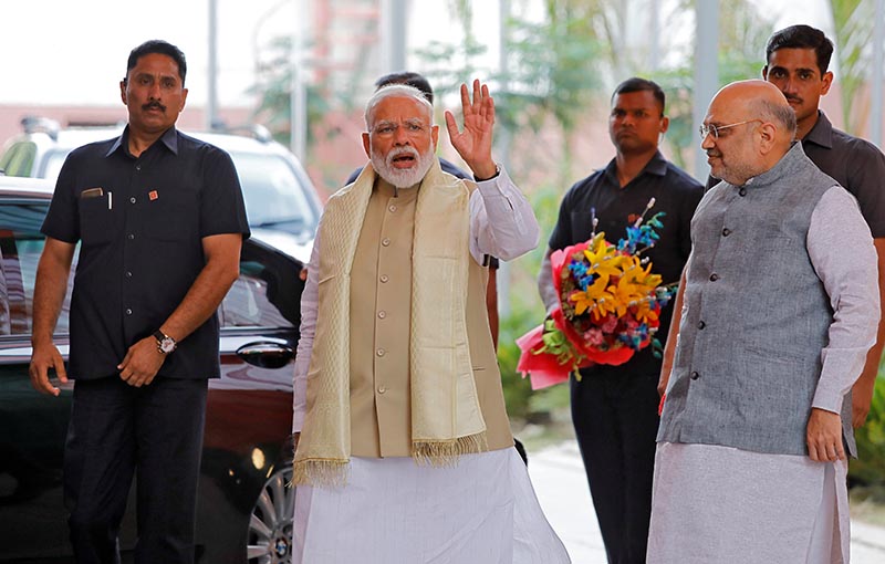 India's Prime Minister Narendra Modi waves to the media as he arrives to attend a thanksgiving ceremony by Bharatiya Janata Party (BJP) leaders to its allies at the party headquarters in New Delhi, India, May 21, 2019. Photo: Reuters