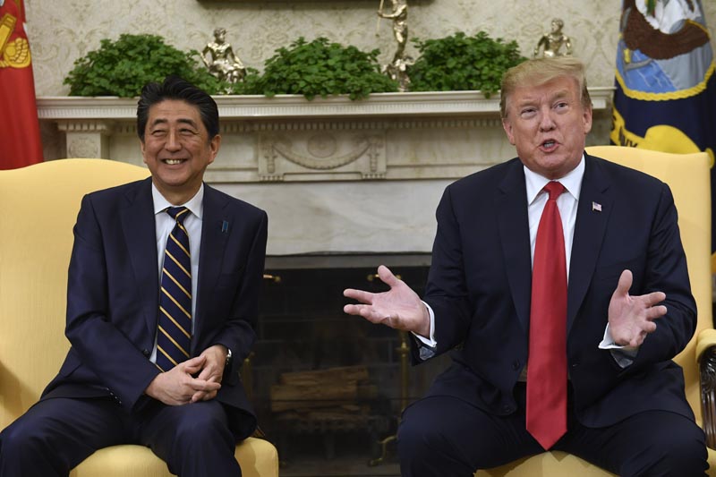 US President Donald Trump, right, speaks while meeting with Japanese Prime Minister Shinzo Abe, left, in the Oval Office of the White House in Washington on April 26, 2019. Photo: AP/File