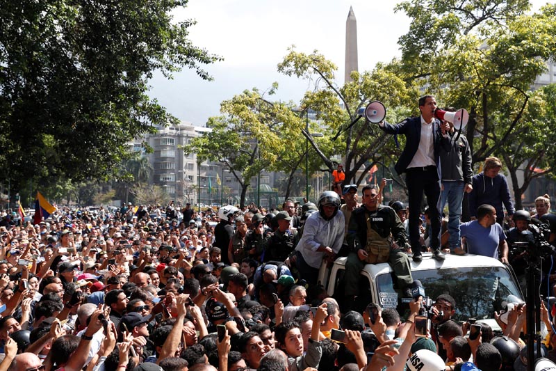 Venezuelan opposition leader Juan Guaido, who many nations have recognised as the country's rightful interim ruler, talks to supporters in Caracas, Venezuela April 30, 2019. Photo: Reuters