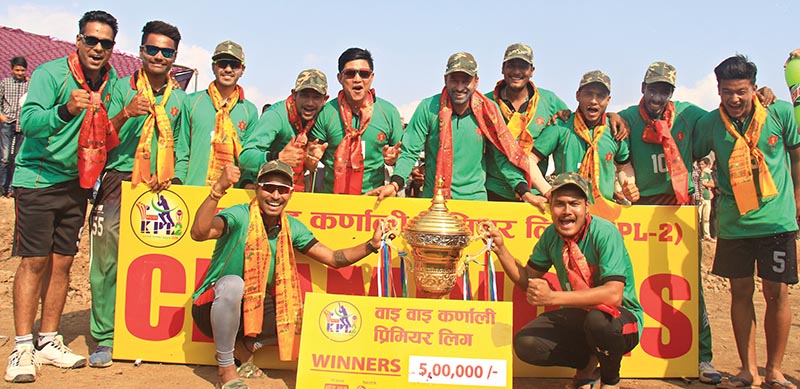 Tribhuvan Army Club team members celebrate with the trophy after winning the third Wai Wai Karnali Premier League at the Kalinchowk grounds in Surkhet on Saturday. Photo: THT