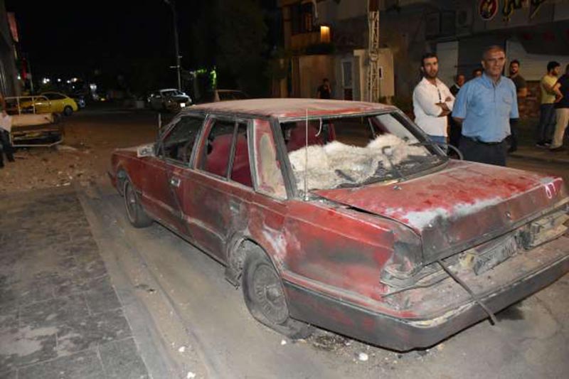 A wrecked vehicle is seen after bomb attacks, leaving 4 dead, 15 wounded, inKirkuk, Iraq on May 30, 2019. Six bomb attacks occurred in various districts of Kirkuk while two others were prevented. Photo courtesy: Ali Mukarrem Garip via Anadolu Agency.