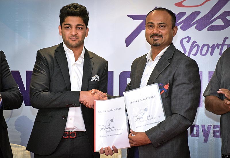 Executive Director of Hansraj Hulaschand and Co Pvt Ltd Abhimanyu Golchha (left) and NSJF President Durganath Subedi exchange MoU in Kathmandu on Sunday. Photo: THT