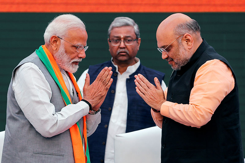 FILE PHOTO: Indian Prime Minister Narendra Modi and chief of India's ruling Bharatiya Janata Party (BJP) Amit Shah, greet each other before releasing their party's election manifesto for the April/May general election in New Delhi, India, April 8, 2019. Photo: Reuters