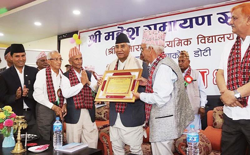 Nepali Congress President Sher Bahadur Deuba being honoured by Sitaram Secondary School in Doti, on Saturday. Photo: THT