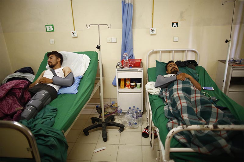 Men beaten up by a business partner and his wife receiving treatment at Om Hospital, in Kathmandu ,on Wednesday, May 15, 2019. Photo: THT
