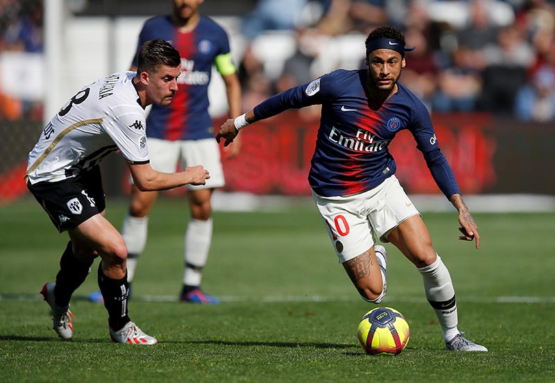 Paris St Germain's Neymar in action with Angers' Baptiste Santamaria  during the  Ligue 1 match between Angers  and Paris St Germain, at Stade Raymond Kopa, in Angers, France, on May 11, 2019. Photo: Reuters